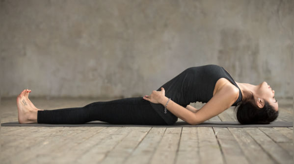 Person demonstrating Matsyasana, or Fish Pose.