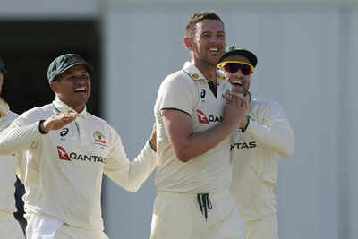 Josh Hazlewood celebrates a crucial wicket against the West Indies.