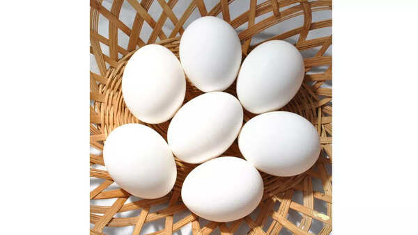 Close up of fresh eggs, showing vibrant yolks