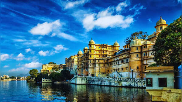 A stunning palace reflecting on the serene waters of a lake.