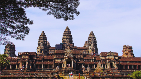 Angkor Wat reflecting in the water at sunrise