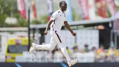 Shamar Joseph celebrates taking a wicket against Australia